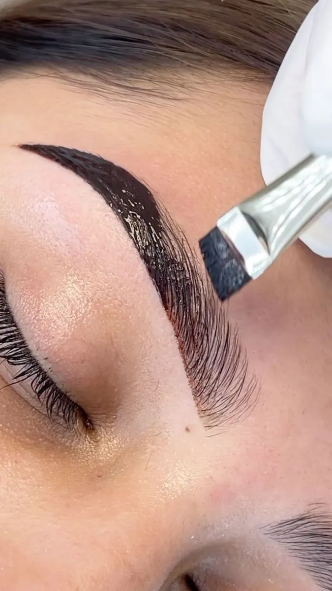 Eyebrow microblading procedure in progress