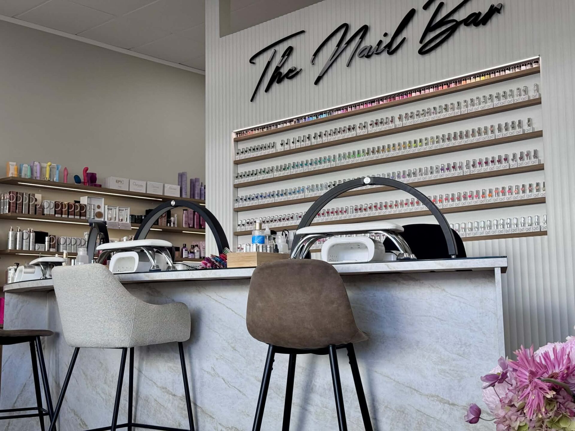 Modern nail salon with polish displays