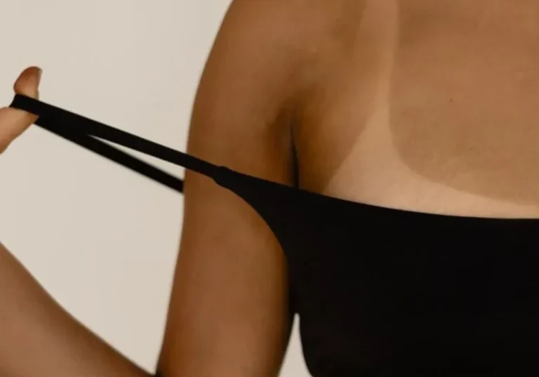 Close-up of woman stretching black bandeau strap