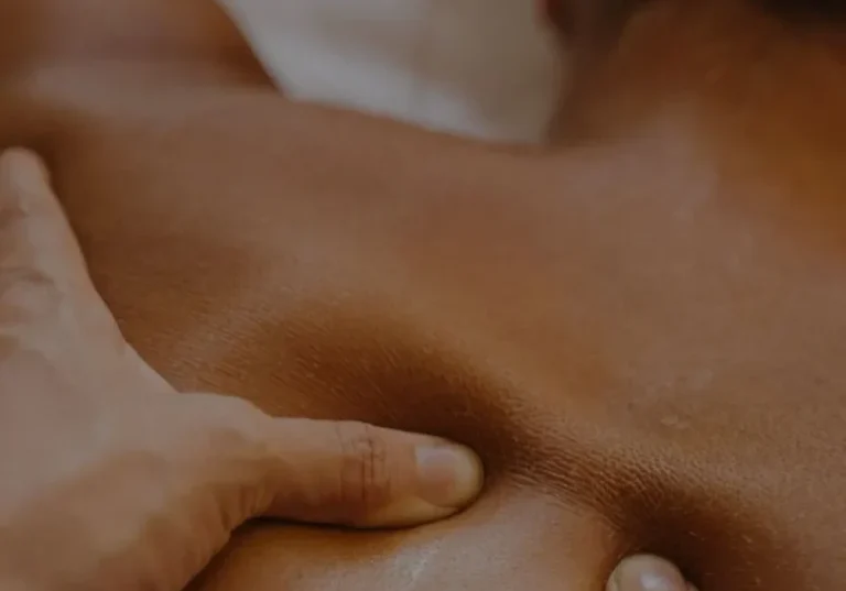 Close-up of hands giving a massage.