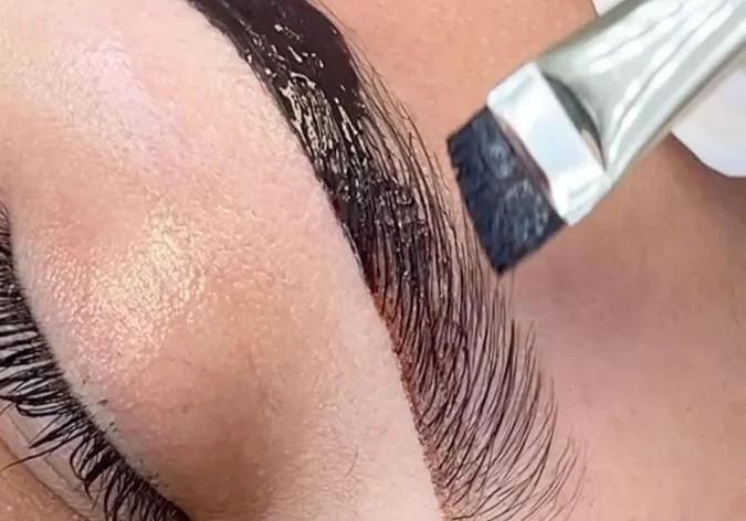 Eyebrow microblading procedure in progress