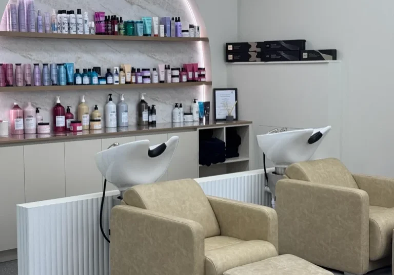 Modern salon with shampoo stations and products